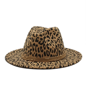 Close-up of leopard print fedora hat featuring golden bead accents and wide flat brim