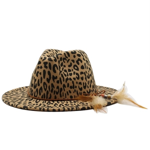 Detail of leopard print fedora hat featuring side feather decor and beaded leather band
