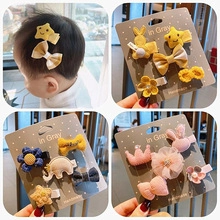 Detail view of assorted colorful hair clips set featuring stars rabbits and bows