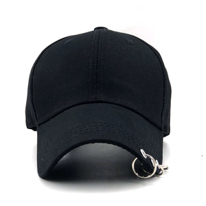 Black cotton baseball cap with three silver rings on brim in streetwear style