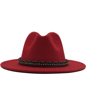Elegant red wool fedora hat with rhinestone leather band for women on white background