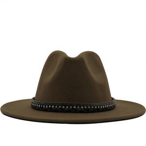 Close-up of wide-brimmed wool fedora featuring rhinestone trim and braided band detail