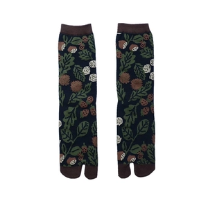 Detail of navy blue Tabi socks with acorn patterns and brown split toe design