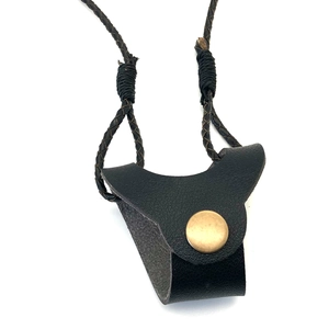 Detail of black faux leather sunglass holder with gold snap button and woven neck strap