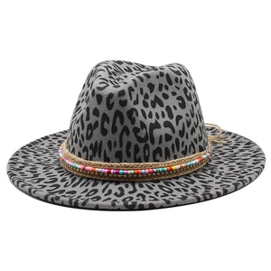 Detail of grey leopard print fedora with colorful bohemian beaded band and woven rope