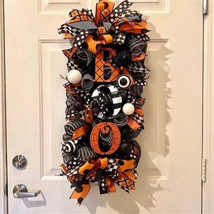 Halloween front door wreath featuring mesh ribbons and Boo letters with pumpkin motif