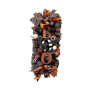 Halloween front door wreath featuring orange BOO letters and spider web ribbons decoration