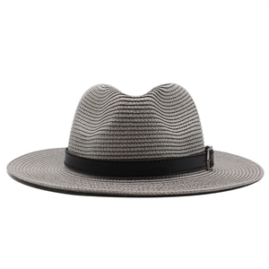 Close-up of gray Panama hat woven texture with black leather band and silver buckle