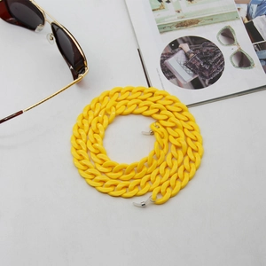 Detail of yellow acrylic link glasses chain with anti-slip silicone loops and metal rings