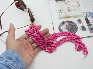 Macro shot of rose red resin chunky eyeglass chain with silicone anti-slip loop