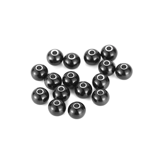 Detail of round black spacer beads with metallic silver center holes for jewelry making