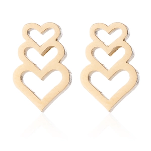Three-layered golden hollow heart drop earrings made of stainless steel on white background