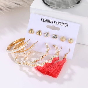 6-piece gold geometric earring set with red tassels and pearls on display card