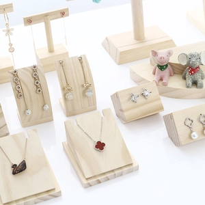 Solid wood jewelry display stand set for earrings and necklaces on white background