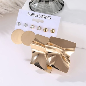 Detail view of 5-pair gold-plated fashion earrings set with crystal studs and metal plates