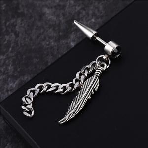 Titanium steel wing earring with chain tassel and black stone inlay on black background