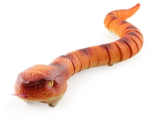 Close-up of realistic orange rattlesnake toy with detailed scales and moving wheels