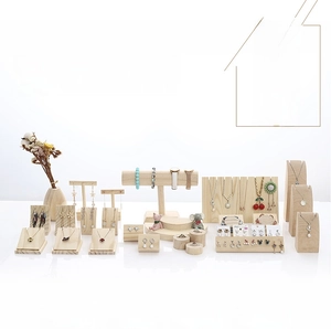 Detail view of solid wood jewelry display set with natural wood grain for necklaces