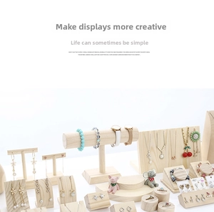 Solid wood jewelry display set with necklace stand and bracelet holders in light wood