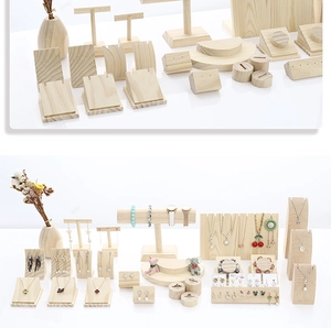 Detailed view of natural wooden jewelry display set for necklaces and rings