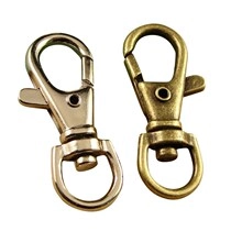 Close-up of swivel lobster clasps in silver and antique bronze metal for keychains
