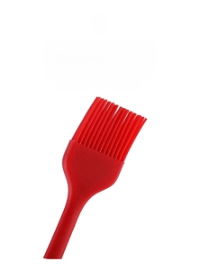 Macro view of a red food-grade silicone oil brush with heat-resistant bristles