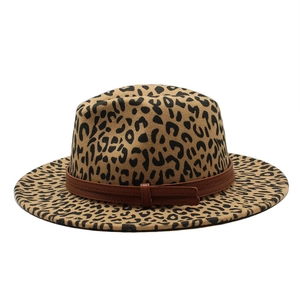 Detailed close-up of leopard print wool felt fedora with stylish brown leather belt buckle