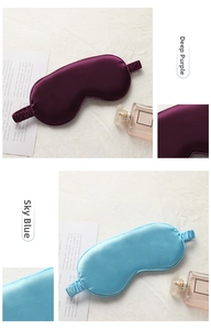 Detail of silk-like sleep masks in dark purple and sky blue with elastic straps