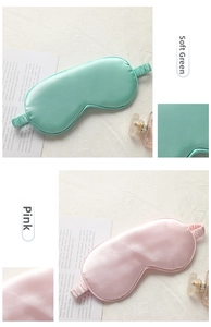 Detailed view of elegant green and pink silk sleep masks with elastic headbands