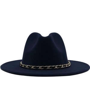 Close-up of navy blue wool fedora hat featuring a gold and black chain band detail