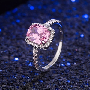 Classic vintage silver ring with cushion-cut pink gemstone and zircon halo setting