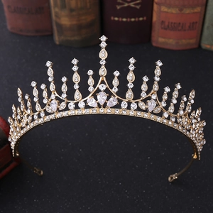 Detail of gold geometric bridal crown with zircon crystals on a vintage black background