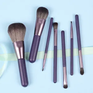 Detail of 7-piece purple makeup brush set with matte handles and soft synthetic bristles