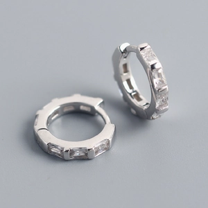 Detail of silver S925 geometric earrings with rectangular cubic zirconia stones
