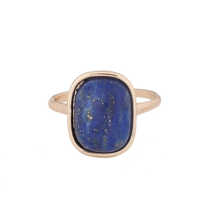 Vintage style gold ring featuring a rectangular lapis lazuli stone on white background
