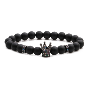 Matte black stone beaded crown bracelet with multicolored zircons on white background