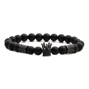 Matte black stone beaded bracelet with crown charm and crystal-encrusted spacers