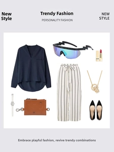 Detail view of stylish blue reflective lightning-shaped sunglasses in a fashion flat lay