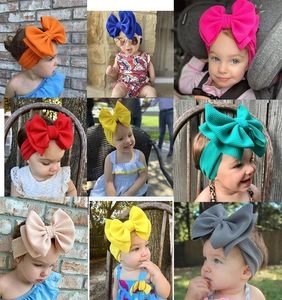 Collage of colorful elastic ribbed headbands with large fabric bows for infants and toddlers