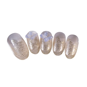 French gradient press-on nails with golden glitter tips and 3D blue butterfly accents