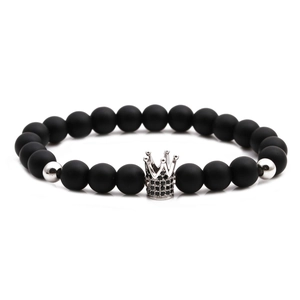 Detail of matte black stone bracelet featuring a silver crown bead with micro-pave zircons
