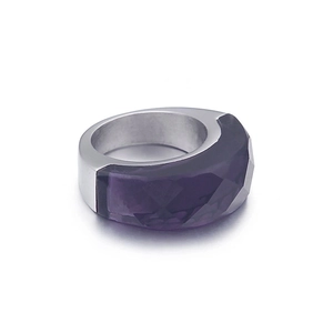 Modern stainless steel ring featuring a purple faceted resin stone inlay on white background