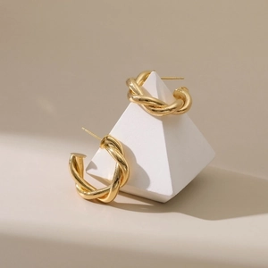 18K gold plated twisted hoop earrings with irregular minimalist spiral texture design