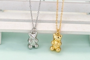 Cute minimalist teddy bear pendant necklace in gold and silver finish for women