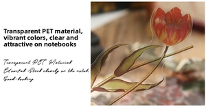 Detail of transparent PET sticker featuring a vibrant red-yellow tulip for DIY journals
