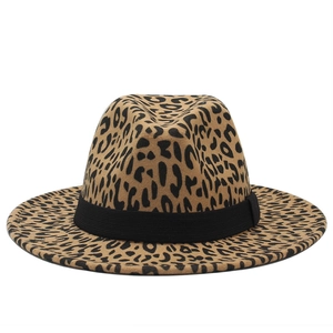 Detailed view of the leopard print fedora hat with a black ribbon band on a flat brim