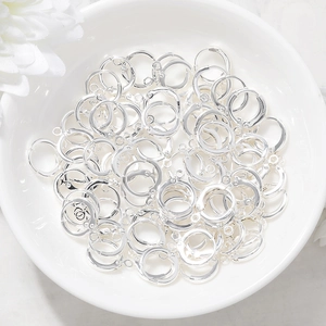 Silver leverback earring hooks in white ceramic bowl for handmade jewelry DIY