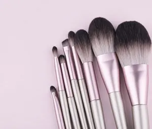 Detail of 9-piece makeup brush set with champagne gold handles and synthetic bristles