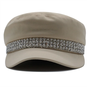 Beige newsboy cap for women with pearl and rhinestone embellishments in a retro style