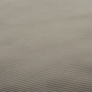 Macro detail of beige waffle knit fabric texture showing high-density weaving on the hat